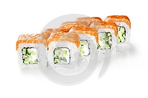 Philadelphia rolls with cream cheese and cucumbers topped raw salmon fillet