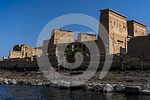 Philae Temple is located on an island of the Aswan Low Dam, downstream of the Aswan Dam and Lake Nasser, Egypt