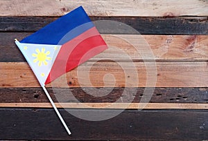 Philippine Flag Top View on a Rustic Wood table photo