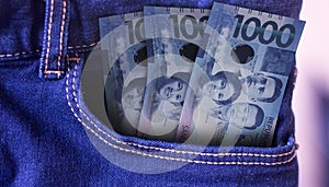 Paraguay 100000 Guaranies Banknotes in Pocket of Jeans photo