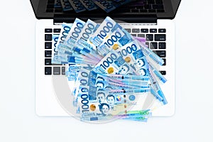 Philippine peso bill with laptop computer, Philippines money currency, Philippine money bills background, Concept make peso money photo