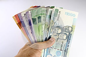 Philippine Peso Bills Held in Hand photo