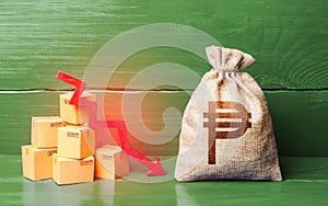 Philippine peso money bag with boxes and down arrow. Income decrease, slowdown and decline of economy. Low sales. Production