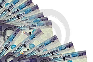 100 Philippine piso bills lies isolated on white background with copy space stacked in fan close up