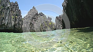 Philippine Sea cliffs rise up into the clear blue sky