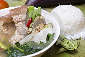 Philippine traditional dish: Sinagang pork soup with vegetables and rice