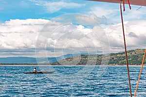 Philippines, Negros Island - Feb 05, 2018: Tourists watch wild dolphins in the sea at Manjuyod White Sand bar