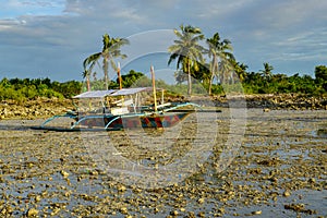 Sea boat in low tide, Philippine photo