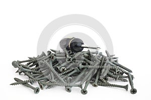 Philips head driver on a pile of screws