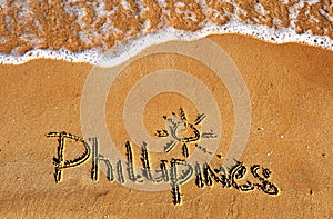 Phillipines word on sand beach background