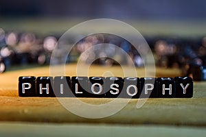 PHILOSOPHY concept wooden blocks on the table