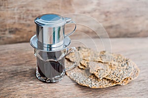 `Phin` traditional Vietnamese coffee maker, place on the top of glass, add ground coffee then pour hot water and wait