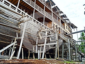 The phinisi shipbuilding process can be seen from the side