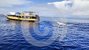 Phinisi traditional boat transport tourist to swim , Snorkling and visit Komodo dragon national park photo