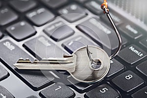 Phishing, hacking personal data and money , key and hook on computer keyboard
