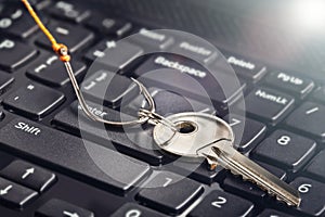 Phishing, hacking personal data and money , key and hook on computer keyboard