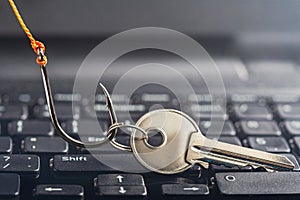 Phishing, hacking personal data and money , key and hook on computer keyboard