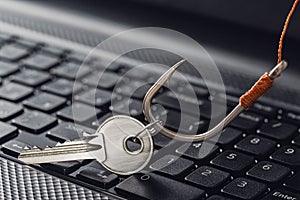 Phishing  personal data , key and hook on computer keyboard