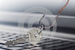 Phishing  personal data , key and hook on computer keyboard