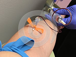 Phlebotomist nurse drawing blood