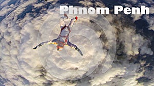 Phnom Penh. Skydiver from Phnom Penh performs a trick in the sky. Free fall.