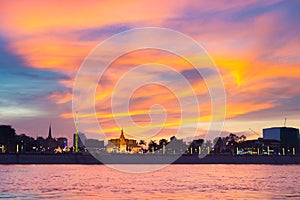 Phnom Penh skyline at sunset capital city of Cambodia kingdom, panorama silhouette view  from Mekong river, travel destination,