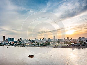 Phnom Penh sunset,as river cruise boat floats along Tonle Sap river towards the Mekong,Cambodia