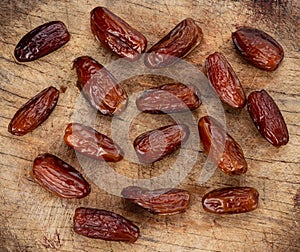 Phoenix dactylifera top view on wooden background