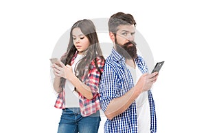 Phone addicts. Father and daughter use mobile phones. Smartphone addicts. Nomophobia