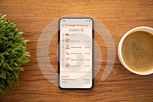 Phone with app tracking delivery package on the screen