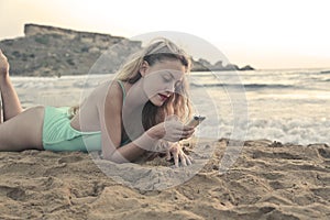 With the phone at the beach