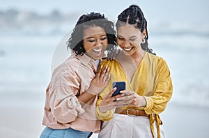Phone, beach and meme with black woman friends laughing together by the ocean or sea in the morning. Nature, joke or