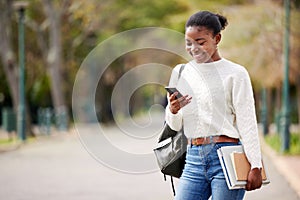 Phone, books and mockup with a student black woman on her commute to university campus for education. Mobile, social