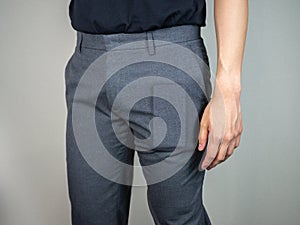 Phone bulge inside trousers on man