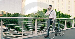 Phone call, business man and bicycle in city to travel with eco friendly transport. Cellphone, bike and happy male