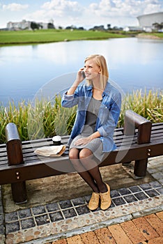 Phone call, park and woman on bench in nature for communication, social networking and chat. Relax, happy and person