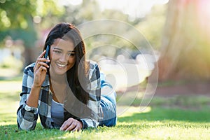 Phone call, relax and woman in a park, summer and happiness with conversation and nature. Person, outdoor and girl with