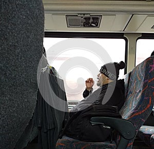 Phone Call While Riding The Bus, Commuter Talking on a Cell Phone, New Jersey, USA