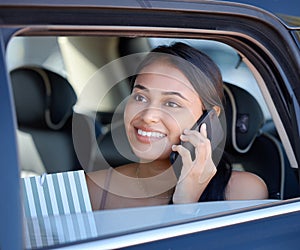 Phone call, shopping and ride share with a woman customer sitting in the backseat of a car for transport. Travel, retail