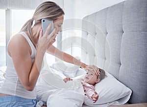 Phone call, sick and child in bed with mother feeling for fever with hand on forehead with worry, care and love. .Family