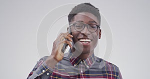 Phone call, smile and black man with conversation, communication and discussion on a white studio background. African