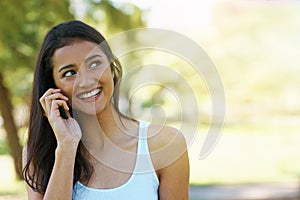 Phone call, smile and woman in a park, summer and happiness with communication and digital app. Person, outdoor and girl