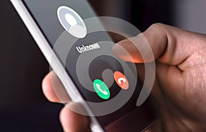 Phone call from unknown number late at night. Scam, fraud or phishing with smartphone concept. Prank caller, scammer or stranger. photo