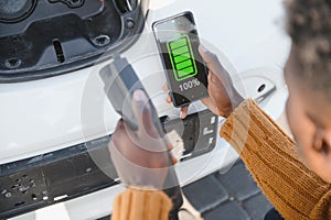Phone charging in car concept, close up image of smart phone charger in car dashboard