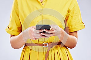 Phone, chat or hands of woman in studio on social media, mobile app or internet web networking online. Texting, research