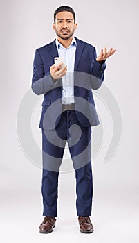 Phone, crisis and asian man portrait in studio confused with scam, alert or internet glitch on grey background. Stress