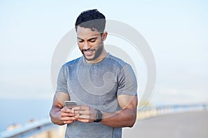 Phone, fitness and app with a sports man tracking his progress online with 5g mobile technology. Exercise, training and