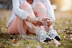 Phone, fitness and woman resting in nature after cardio workout training for race, marathon or olympics. Sports