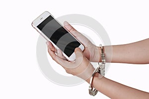Phone in hand with handcuffs