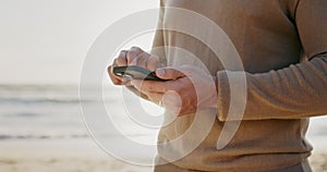 Phone, hands and man at a beach for travel, location and and internet, search or tracking in nature. Smartphone, app and